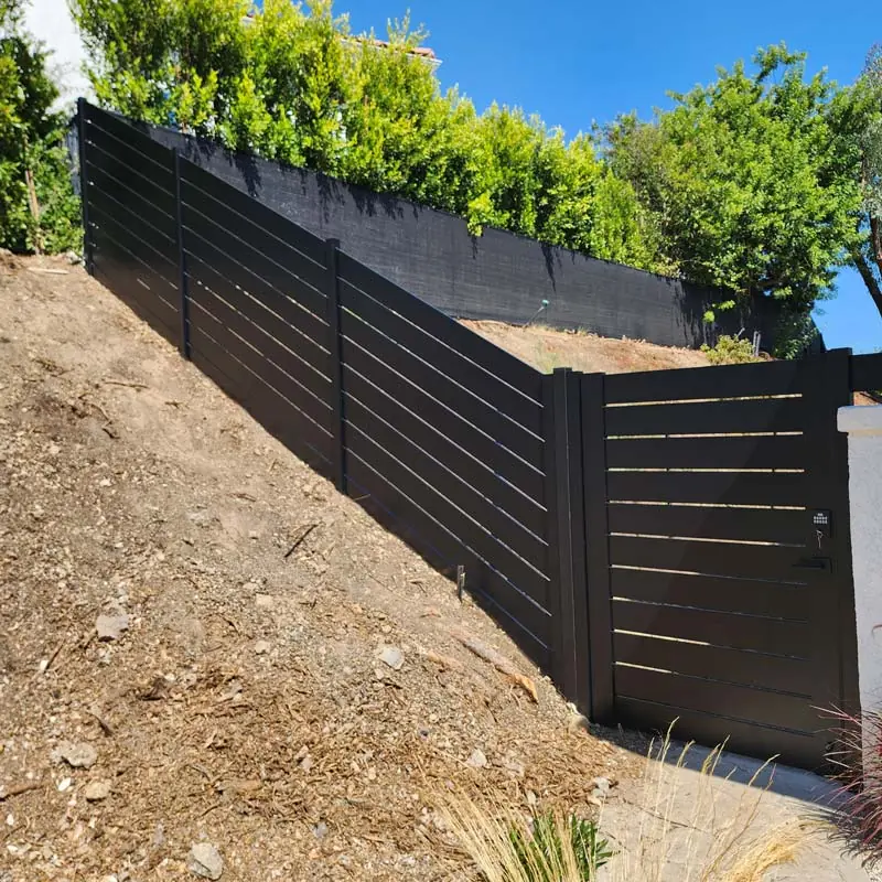 Non-combustible aluminum fence panels installed within five feet of a Calabasas hillside home