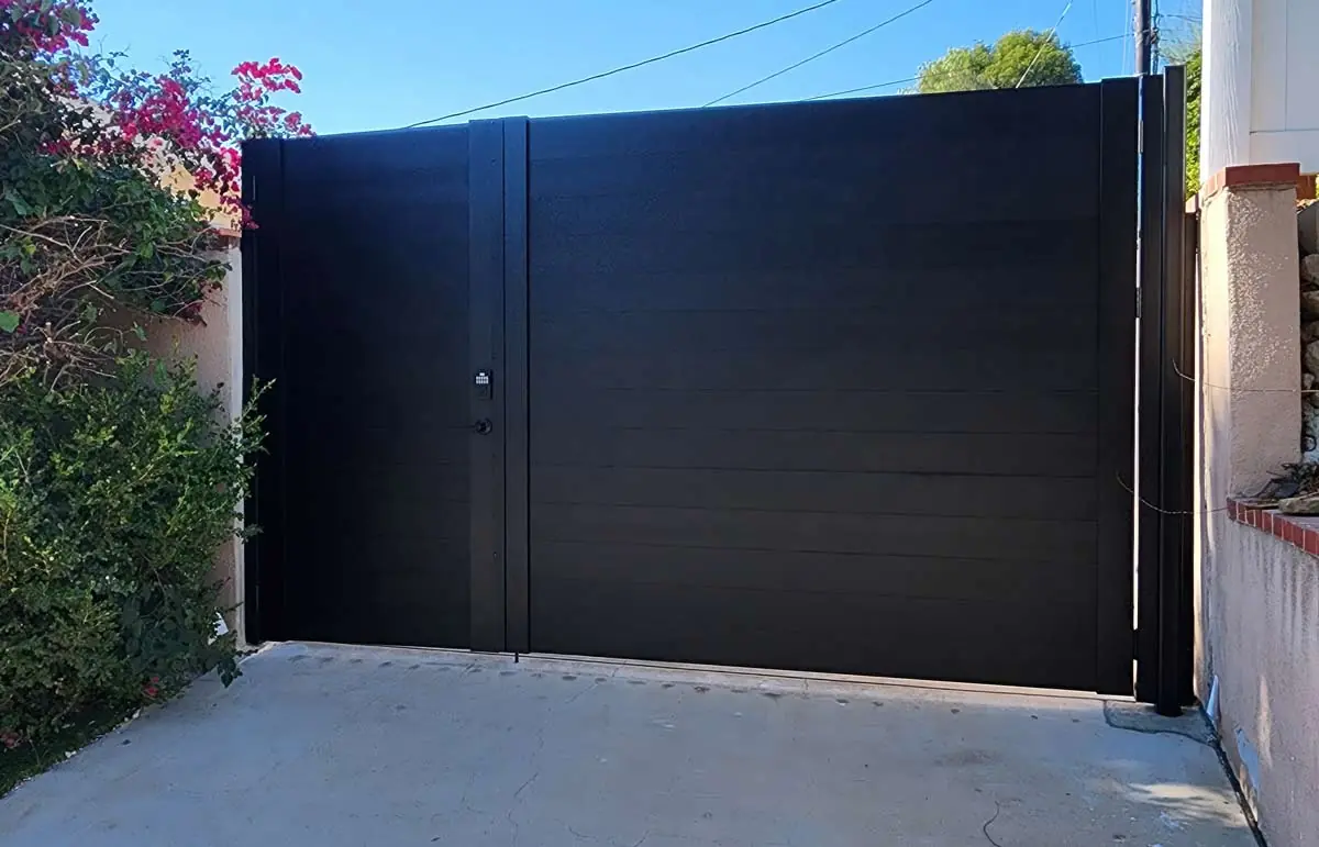 Black full-privacy aluminum driveway gate and pedestrian gate
