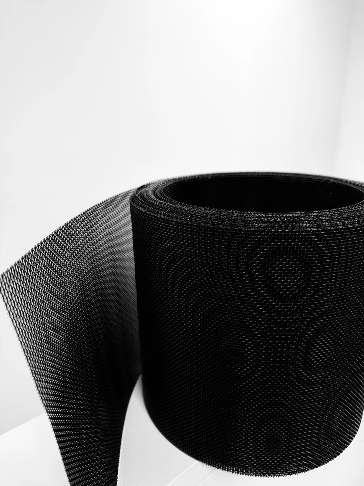 Roll of fine black ember-resistant metal mesh